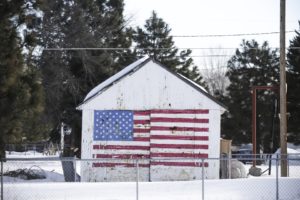 A U.S. flag is painted on a garage in Burns, Oregon